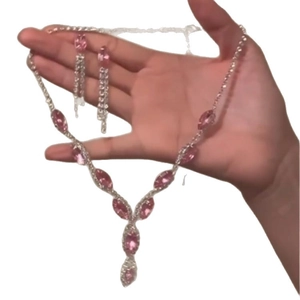 Pink marquise-cut crystal jewelry set featuring a necklace and drop earrings in silver