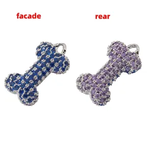 Detailed front and rear view of bone-shaped pendants with blue and purple crystals