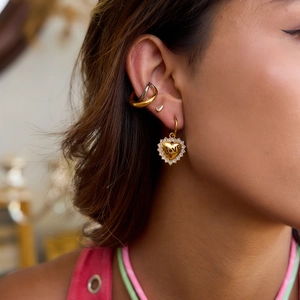 18K gold plated heart earrings with LOVE engraving and crystals on model