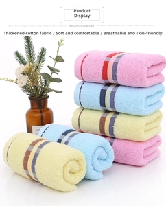 Detail of colorful thickened cotton towels featuring soft absorbent loop textures and stripes