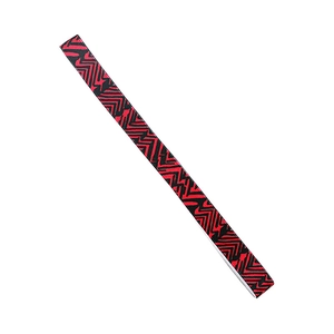 Detail of black sports headband with red geometric lightning pattern on elastic fabric