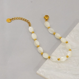 18K gold plated stainless steel bracelet featuring elegant white oval shell beads
