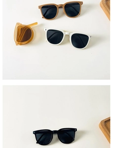 Detailed display of foldable kids sunglasses in yellow, white, black and amber colors