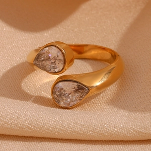 Macro shot of 18K gold plated ring featuring dual teardrop cubic zirconia settings