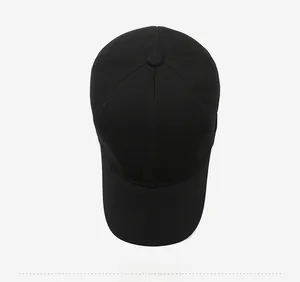 Close-up of black breathable golf cap top with stitched rectangular GOLF logo patch