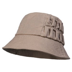 Elegant women's linen bucket hat in dark brown with textured vertical pleats