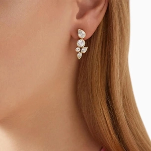 Elegant gold-plated stainless steel cluster drop earrings with clear zircon stones on model