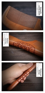 Close-up of thick peach wood comb featuring floral relief carving and smooth teeth