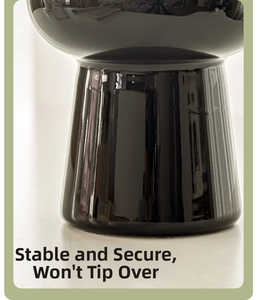Detailed view of the stable high-gloss black glass base of the vintage French vase