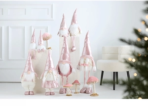 Pink plush Christmas gnomes with sparkling hats and matching decorative mushrooms set