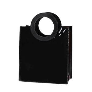 Minimalist black PVC tote bag with unique round handles and glossy mirror finish