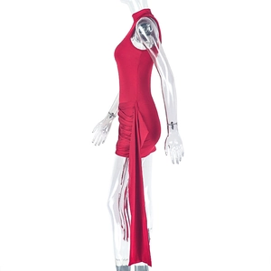 Detail view of red sleeveless mini dress featuring ruched sides and long decorative ties