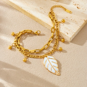 Double-layered gold plated stainless steel bracelet with white leaf pendant and round beads