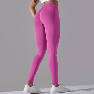 Close-up of seamless rose pink yoga leggings featuring high waist and scrunch butt design