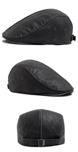 Detail view of black PU leather beret with metal eyelets and adjustable rear buckle strap