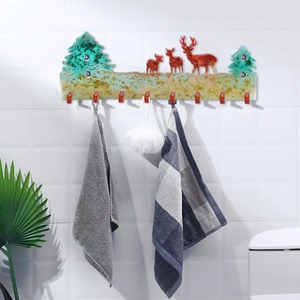 Detail of Christmas elk wall hook mold with eight red hangers and gold foil resin detail