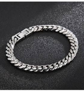 Detail of silver Cuban link bracelet featuring one polished side and one frosted finish