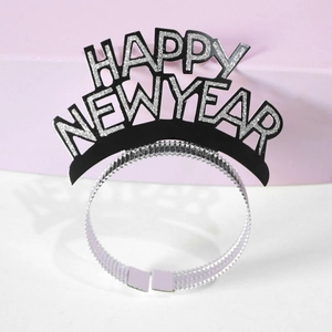 Close-up of sparkling silver Happy New Year lettering on a black festive headband