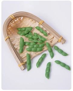 Detailed view of realistic green PVC soybean pods on a mini bamboo basket