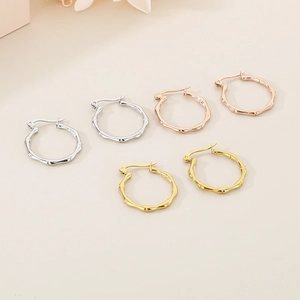 Bamboo style earrings shown in silver, rose gold and gold finishes with metal texture