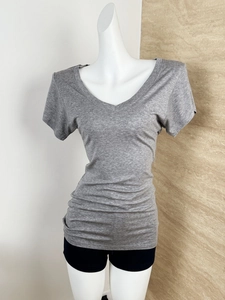 Close-up of the grey V-neck t-shirt made of premium wool tencel knitted fabric texture