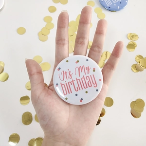 Pink It's My Birthday badge held by hand with colorful polka dots and gold sequins