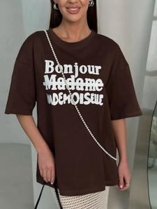 Detail of dark brown cotton oversized t-shirt with Bonjour Madame printed lettering