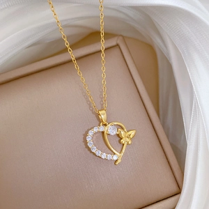 Detailed view of titanium steel gold heart butterfly necklace with white micro-inlaid diamonds