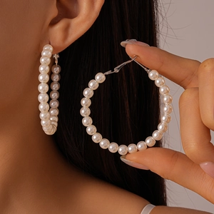 Elegant large hoop earrings with white faux pearl beads and silver-toned needle for women