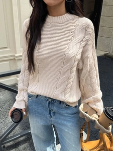 Women's beige cable knit sweater with long sleeves and crew neck in urban street style