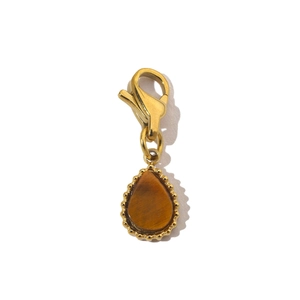Close-up of a gold waterdrop pendant with tiger eye stone and lobster clasp detail