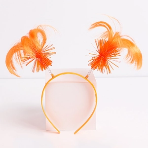 Detail of orange faux fur party headband with spring-loaded patriotic fiber hair