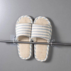 Wall-mounted silver metal curtain rod holder and slipper rack with transparent hooks