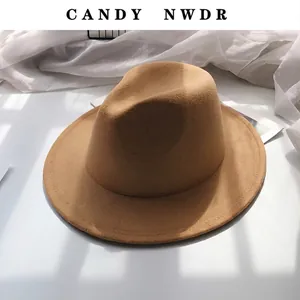 Detail of wide-brimmed camel wool jazz hat featuring refined stitching and a fedora top