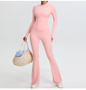 Detail of pink flare yoga pants with V-waist and moisture-wicking athletic fabric
