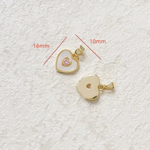 Detail of 16x10mm 18k gold-plated heart pendant with pink mother of pearl inlay