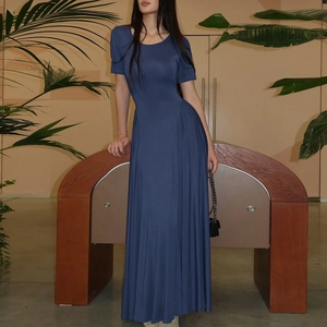 Detail view of deep blue U-neck maxi dress with short sleeves and waist pleats