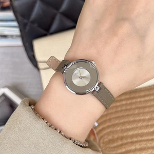 Elegant minimalist women's watch with silver case, grey dial and grey leather strap