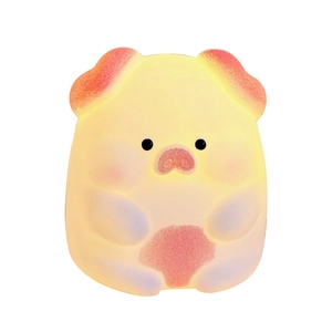 Creative cute pig shaped silicone night light with warm yellow glow and pink details