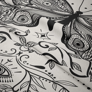 Close-up of psychedelic butterfly tapestry fabric showing fine black and white woven texture