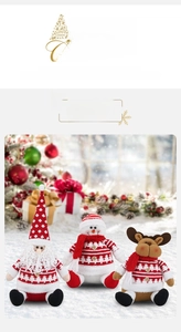 Plush Santa, snowman and reindeer dolls wearing Nordic knit sweaters in Christmas setting