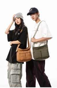Detail of canvas messenger bag with large capacity and multi-pocket functional design