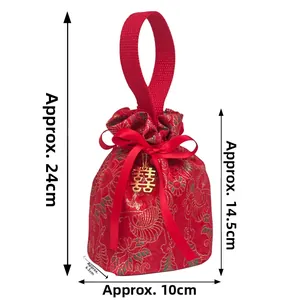 Detail view of red square wedding favor bag with golden Double Happiness pendant and ribbon
