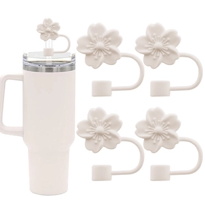 Detail of white cherry blossom silicone straw cover on a tumbler with 10mm straw