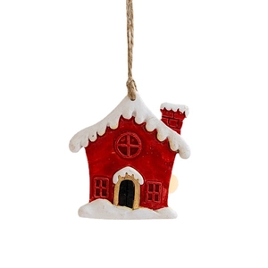 Resin Christmas house pendant with snow details and hanging rope on white background