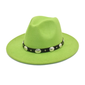 Detail of lime green fedora hat featuring black faux leather band and vintage metal studs