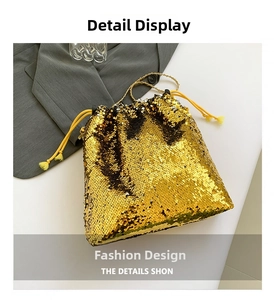 Detail of shimmering gold sequin bucket bag featuring a woven drawstring closure