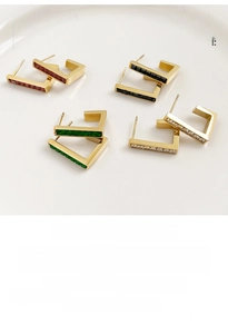 Set of four geometric gold-plated earrings featuring colored zircon rectangular stones