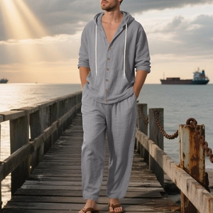 Detail of grey linen-style button-up hooded shirt and matching relaxed trousers set