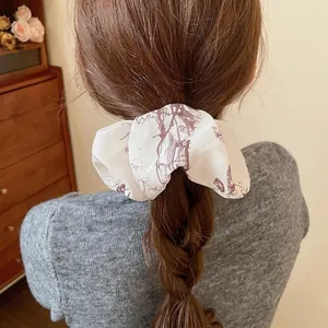 Floral print oversized scrunchie in beige fabric for high ponytail hair styling